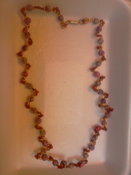gold serpentine necklace using 8/0's and 11/0's.  And 6mm polymer beads.